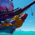 The Collector's Ruby Splashtail Figurehead mounted on a Galleon.