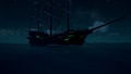The hull on a galleon in the night.
