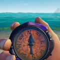 The Inky Kraken Compass in hand.